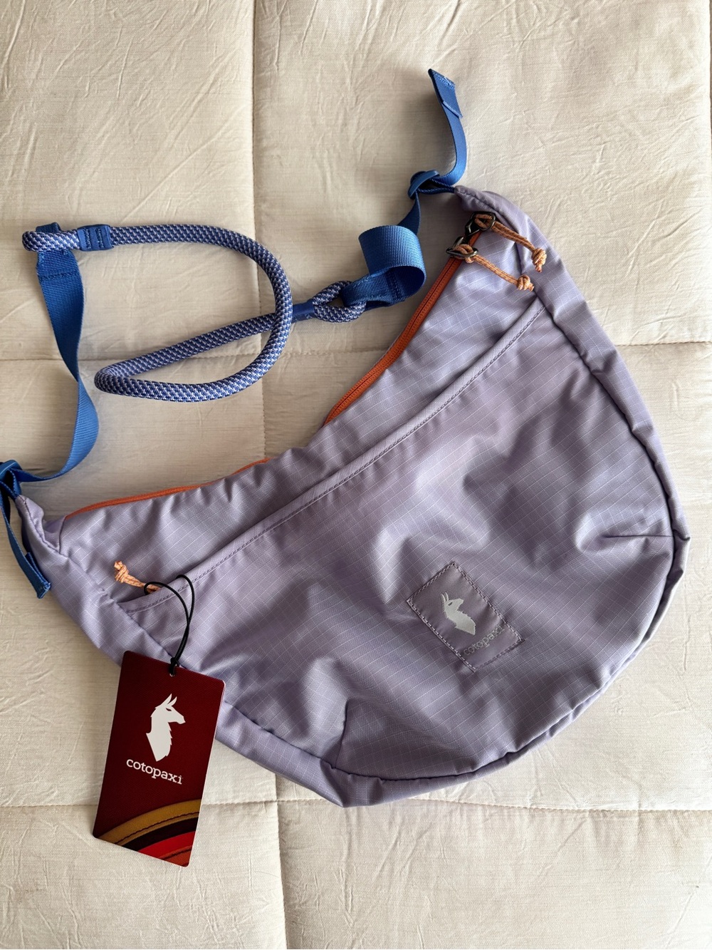 cotopaxi Lavender Crossbody Sling with Blue Strap